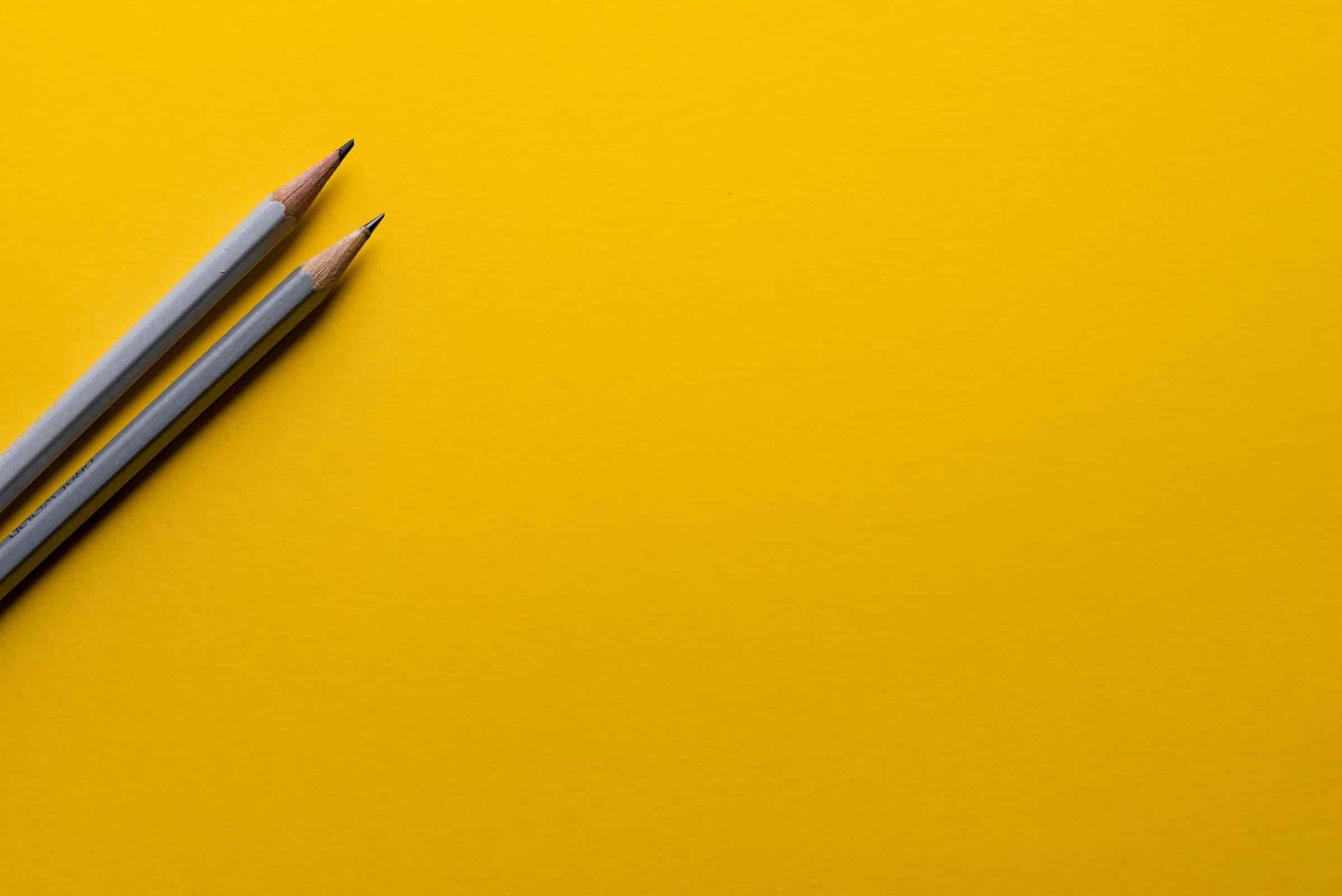 Pencil on yellow background